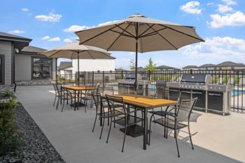 Outdoor dining area with gas grills
